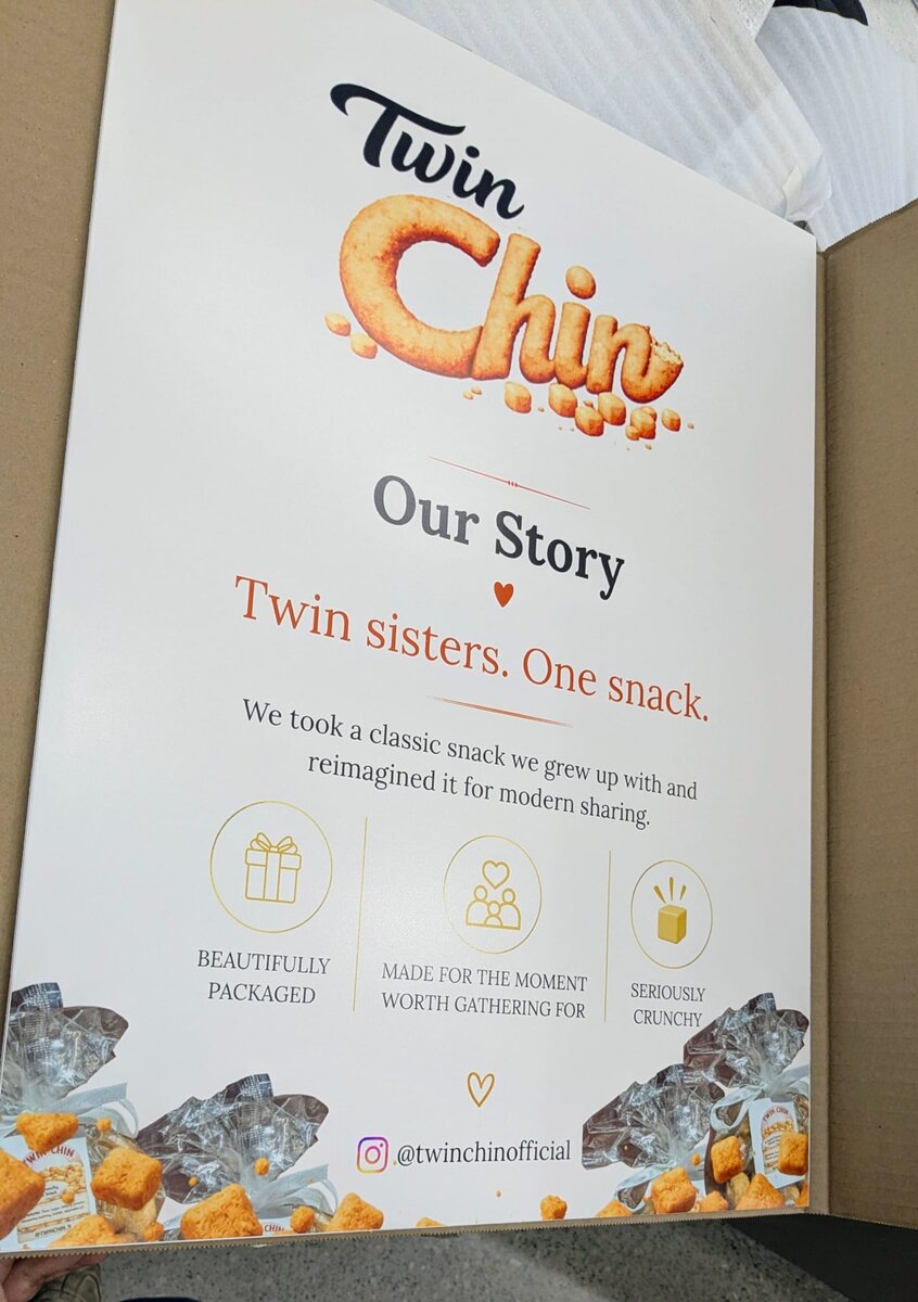 TwinChin sign board with our story and logo, displayed at a pop-up