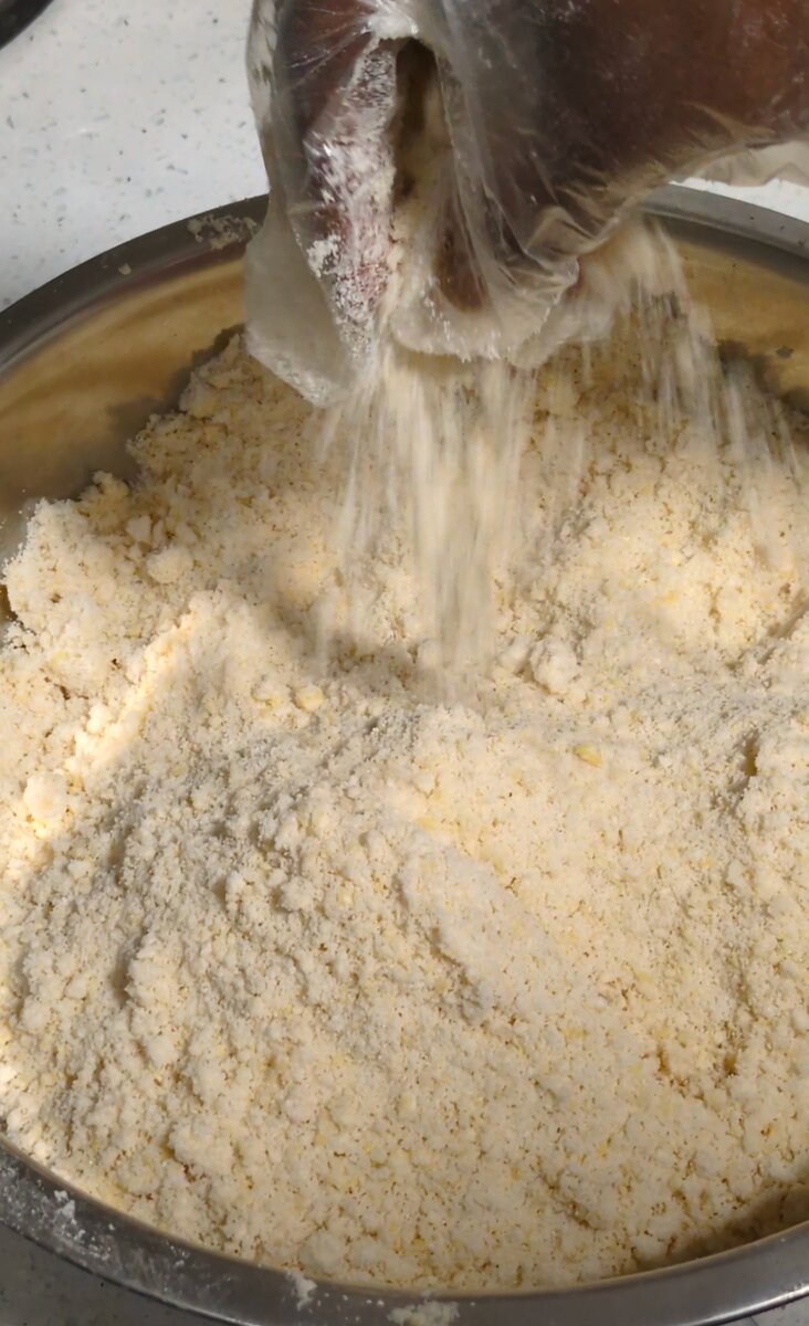 Dry ingredients being mixed by hand